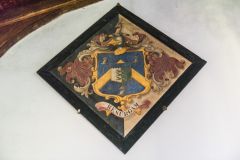Funeral hatchment on the west wall