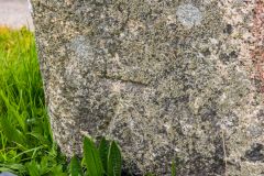 An Ordnance Survey mark carved at the Cross base