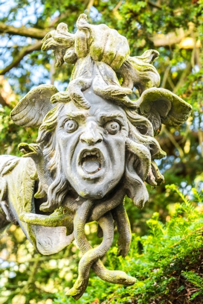 Perseus holds aloft the head of Medusa