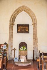 The font and tower arch