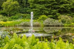 A fountain in front of the mansion house