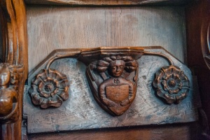 Misericord of an Angel bearing a shield