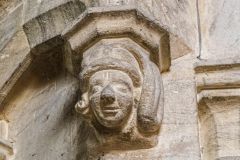 Medieval carved head, crossing