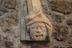 A grotesque medieval head carving