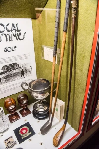 Display of historical wooden golf clubs