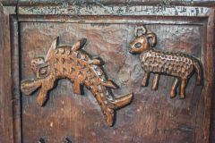 Crude carvings of a fish and sheep