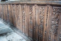The beautifully carved bench end panel