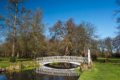 A cast iron bridge across the River Wandle