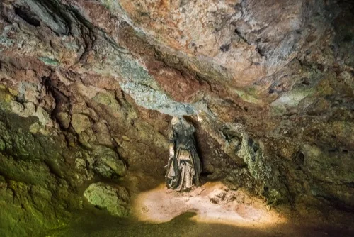 Sculpture of Mother Shipton inside the cave