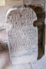 An old gravestone in the church porch