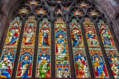 Vividly coloured stained glass, east window