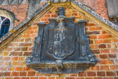 The family coat of arms over the entrance porch