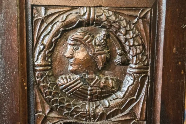 16th-century carved bench end