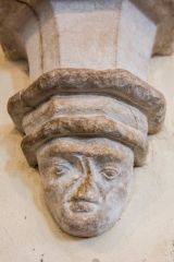 A humorous corbel head carving
