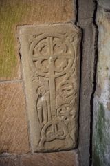 Medieval grave slab set into the porch wall