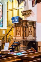 The late 19th-century pulpit and pews