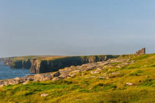 Approaching the castle along the cliffs