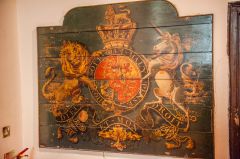 The royal coat of arms painted on boards