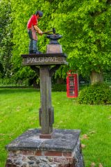 The village sign and listed K9 phone box