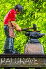 A closeup of the village sign