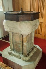 The simply carved 12th century font