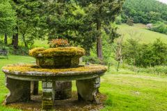 The unusual stone seat and medieval font