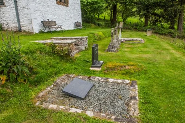 The mass grave (foreground)