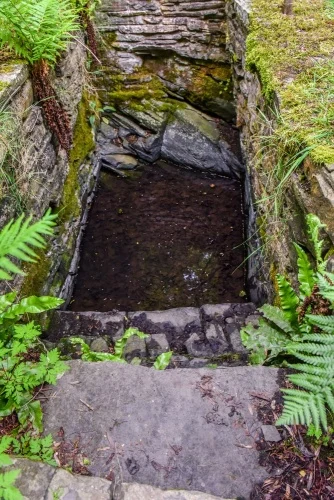 Looking down into the holy well