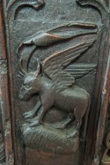 St Luke's bull bench end carving