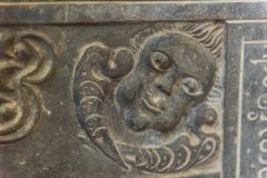 Carved head on a 17th century Trebarfoot memorial slab