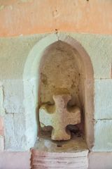 An old cross head in a piscina niche