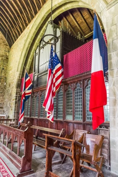American, French and British flags in the chancel