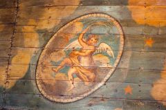 A winged cherub on the painted ceiling