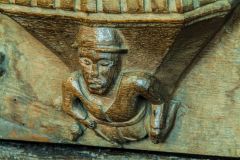 Medieval misericord of a human figure