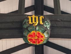 A brightly painted roof boss