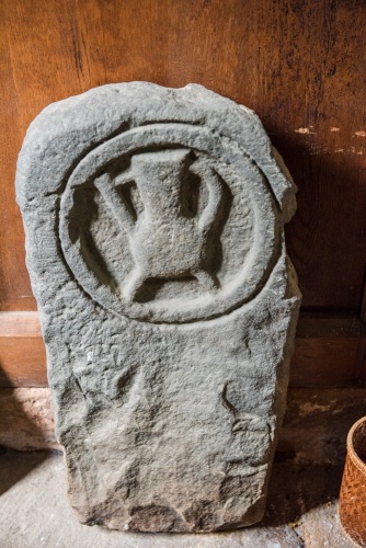 The peculiar medieval jug, or cauldron carving