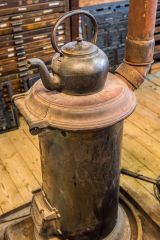 A stove and kettle in the Caseroom