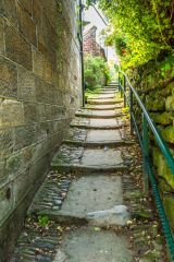 A cobbled footpath between cottages