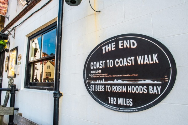 The Coast to Coast Path endpoint plaque near the harbour