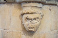 Medieval carved head, nave
