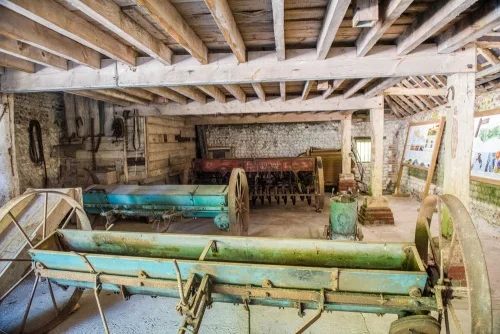 Farm equipment in the 18th-century barn