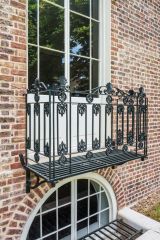The rear balcony with the kitchen window below