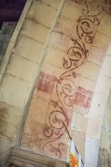 Medieval paint under a nave arcade arch
