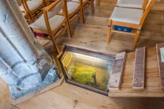 Exposed medieval foundation n the nave floor