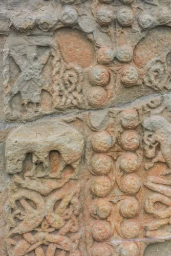 Angels and beasts on the cross face