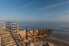 A wooden pier stretches into the North Sea