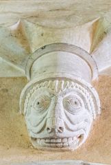 A grotesque corbel head in the church