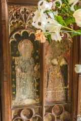 Defaced saints on the chancel screen base