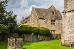 The 15th-century manor house beside the churchyard