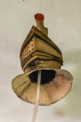 17th-century funeral helm over the Strange memorial